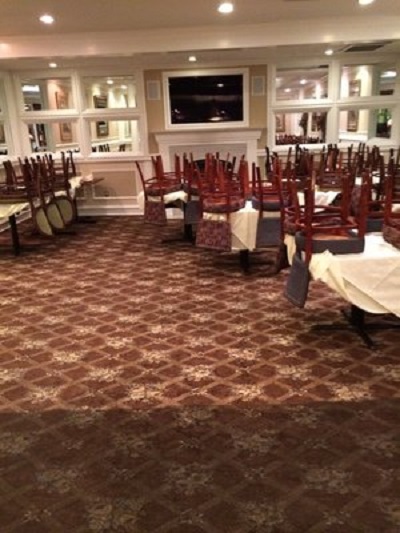 Hotel dining room prepared for commercial carpet cleaning services